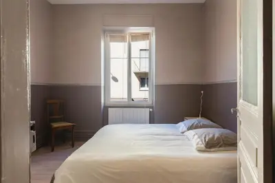 Un ou plusieurs lits dans un hébergement de l'établissement Colmar Apartment