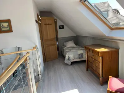 Un ou plusieurs lits dans un hébergement de l'établissement Gîte chez Marie-Sarah petite maison calme parking