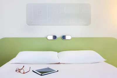Un ou plusieurs lits dans un hébergement de l'établissement Ibis Budget Mulhouse Centre Gare