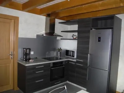 Cuisine ou kitchenette dans l'établissement Les jonquilles