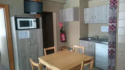 Cuisine ou kitchenette dans l'établissement Camping du Ô des bluches