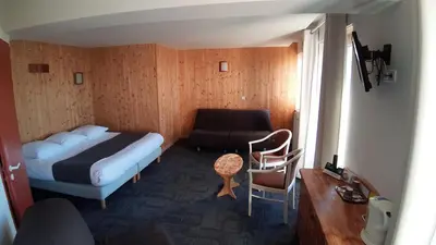 Un ou plusieurs lits dans un hébergement de l'établissement Hotel De La Route Verte