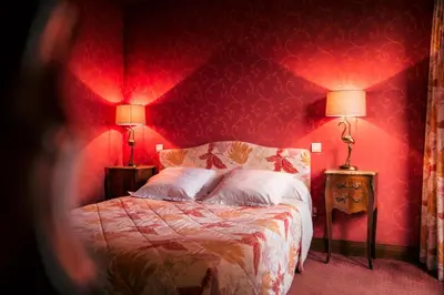 Un ou plusieurs lits dans un hébergement de l'établissement Hôtel des Deux Clefs