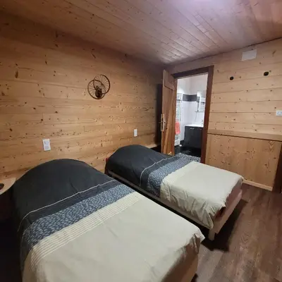 Un ou plusieurs lits dans un hébergement de l'établissement chalet des cyclistes