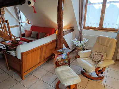 Coin salon dans l'établissement Un balcon sur les toits