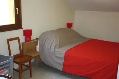 Un ou plusieurs lits dans un hébergement de l'établissement La Maison Jaune