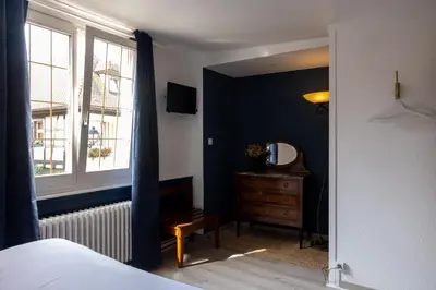 Un ou plusieurs lits dans un hébergement de l'établissement L'Auberge du Brand
