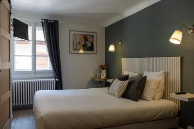 Un ou plusieurs lits dans un hébergement de l'établissement L'Auberge du Brand