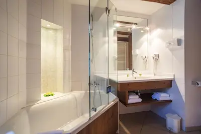 Salle de bains dans l'établissement Hostellerie Schwendi