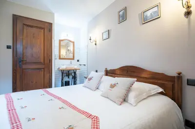 Un ou plusieurs lits dans un hébergement de l'établissement Hôtel Berceau Du Vigneron
