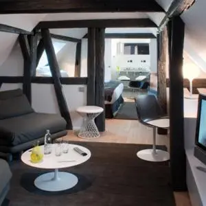 Coin salon dans l'établissement Hôtel Quatorze