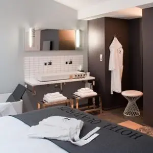 Un ou plusieurs lits dans un hébergement de l'établissement Hôtel Quatorze