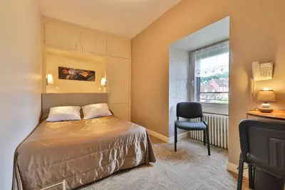Un ou plusieurs lits dans un hébergement de l'établissement Hôtel Bar Des Vosges