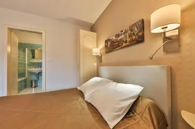 Un ou plusieurs lits dans un hébergement de l'établissement Hôtel Bar Des Vosges