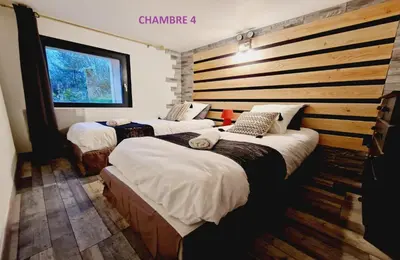 Un ou plusieurs lits dans un hébergement de l'établissement Gitedaval La Revauche et spa