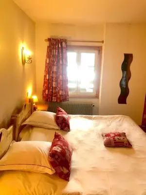 Un ou plusieurs lits dans un hébergement de l'établissement L'Auberge au Bord du Lac