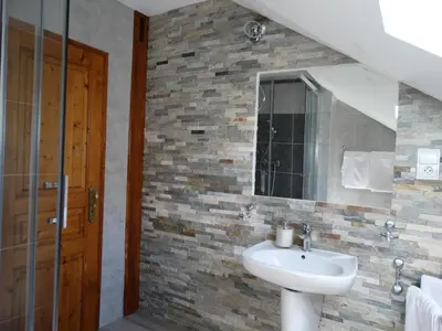 Salle de bains dans l'établissement La Maison Fleurie