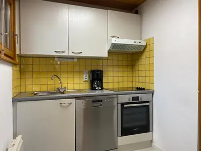 Cuisine ou kitchenette dans l'établissement Chalet Sapin