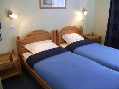 Un ou plusieurs lits dans un hébergement de l'établissement Hôtel Restaurant Wolf