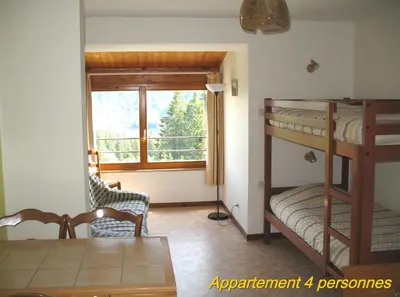 Un ou plusieurs lits dans un hébergement de l'établissement Les Terrasses du Lac Blanc - Studios & Appartements