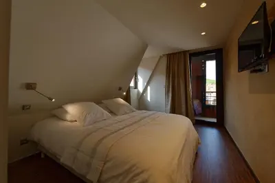 Un ou plusieurs lits dans un hébergement de l'établissement The One Apartments