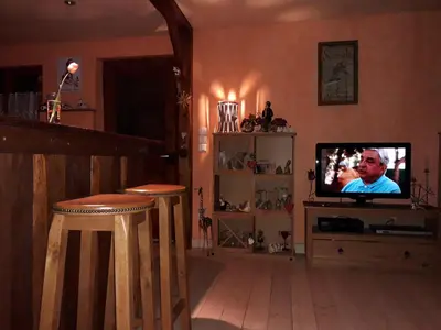 Télévision ou salle de divertissement dans l'établissement Gite