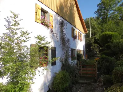 Jardin de l'établissement Auberge De La Grange spa & sauna