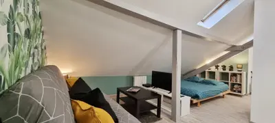 Un ou plusieurs lits dans un hébergement de l'établissement 2 Charmants logements * CHARMANT GITE COLMAR *