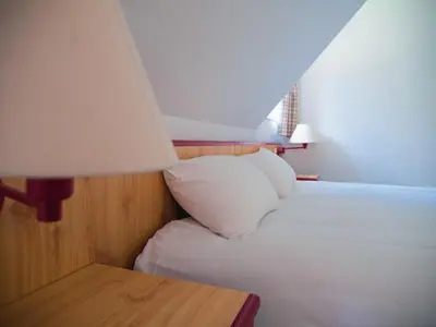 Un ou plusieurs lits dans un hébergement de l'établissement Les Loges de l'Ecomusée D'Alsace