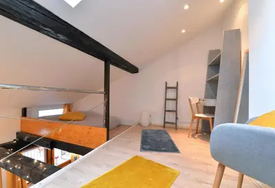 Un ou plusieurs lits dans un hébergement de l'établissement Appartement La Terrasse sur cour