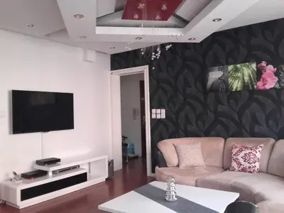 Télévision ou salle de divertissement dans l'établissement Appartement La Bagatelle