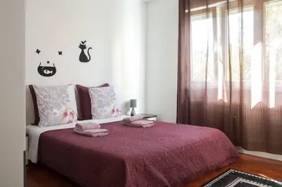 Un ou plusieurs lits dans un hébergement de l'établissement Appartement La Bagatelle
