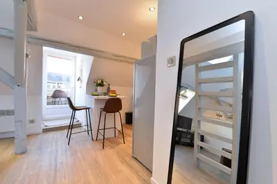 Un ou plusieurs lits dans un hébergement de l'établissement Appartement La petite terrasse sur les toits
