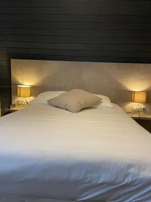 Un ou plusieurs lits dans un hébergement de l'établissement Hôtel La Réserve
