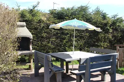 Jardin de l'établissement Chalet Les Bouleaux, la montagne des lamas