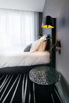 Un ou plusieurs lits dans un hébergement de l'établissement Hotel Restaurant Les Capucins
