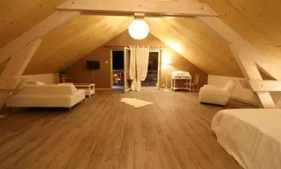 Coin salon dans l'établissement Chambres d'hôtes Couleurs Bois & Spa