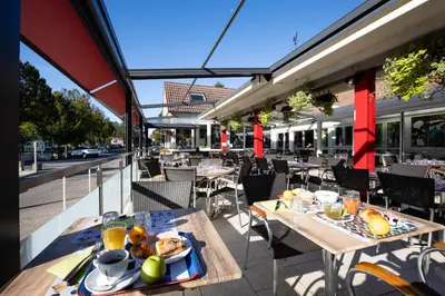 Restaurant ou autre lieu de restauration dans l'établissement Hotel-Restaurant Espace Squash 3000