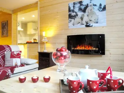 Coin salon dans l'établissement Appartement spacieux à Xonrupt-Longemer + Sauna