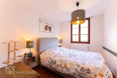 Un ou plusieurs lits dans un hébergement de l'établissement Au Bonheur des Anges Appartement 2 chambres avec terrasse