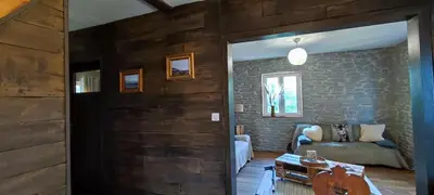 Coin salon dans l'établissement Chalet aux 2 sapins