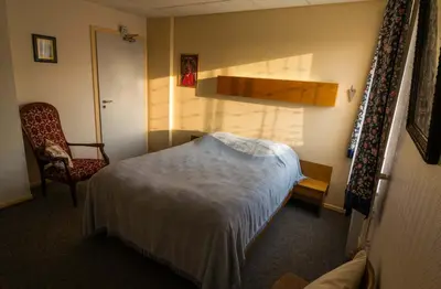Un ou plusieurs lits dans un hébergement de l'établissement Hôtel de Bâle