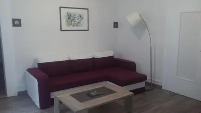 Coin salon dans l'établissement Apartment Corneille
