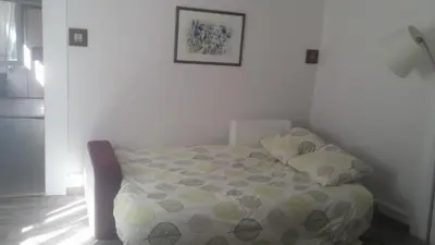 Un ou plusieurs lits dans un hébergement de l'établissement Apartment Corneille