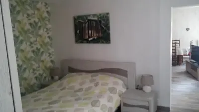 Un ou plusieurs lits dans un hébergement de l'établissement Apartment Corneille
