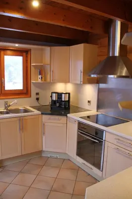 Cuisine ou kitchenette dans l'établissement Chalet centaurée - Rémy HEROLD