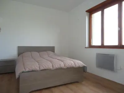 Un ou plusieurs lits dans un hébergement de l'établissement cottage pleine nature