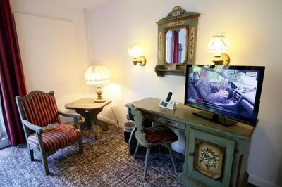 Télévision ou salle de divertissement dans l'établissement Les Portes de la Vallee