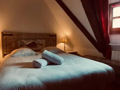 Un ou plusieurs lits dans un hébergement de l'établissement Gîte Maison des Vignerons
