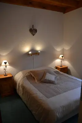 Un ou plusieurs lits dans un hébergement de l'établissement Les Loges du Lac - Appartement avec Terrasse